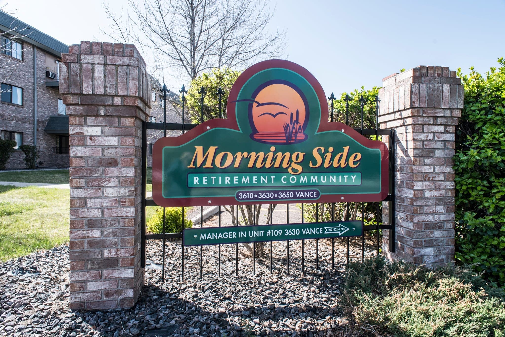 The entrance sign between two brick pillars, reading “Morning Side Retirement Community, 3610 · 3630 · 3650 Vance” and, below, “Manager in unit #109, 3630 Vance”.